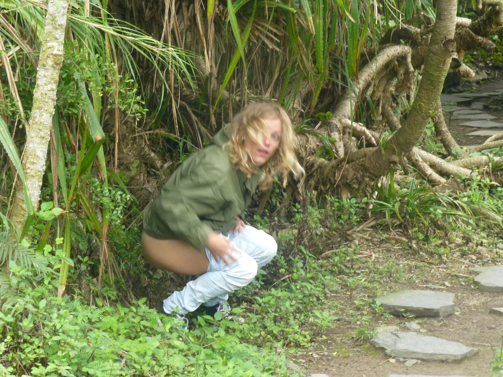 Girl peeing in bush