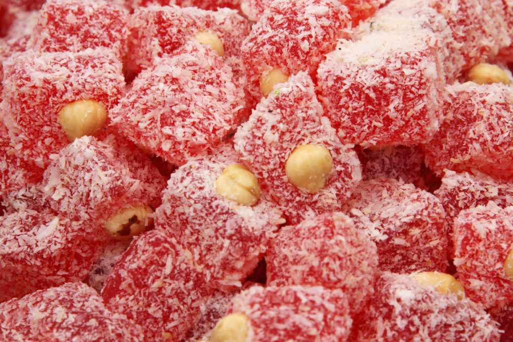 Sugar coated red candy with almonds 