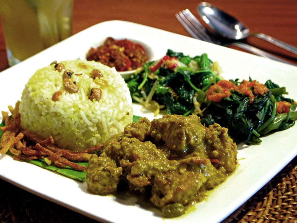 Lamb curry served with rice, side veges