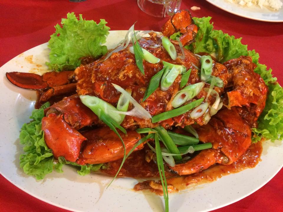 Spicy prawns on white plate with garnish
