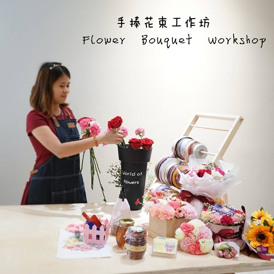 Flower bouquet workshop with lady at centre arranging flowers