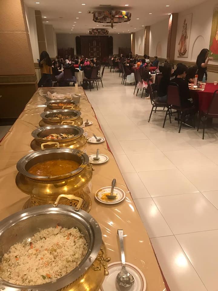 Buffet spread with dishes in a row
