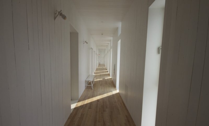 White hallways with a stream of light