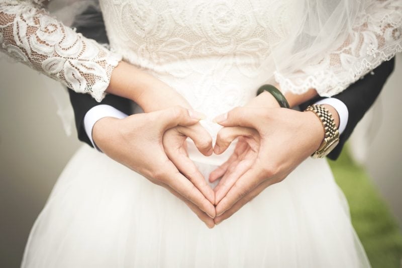 couple hands heart shape wedding