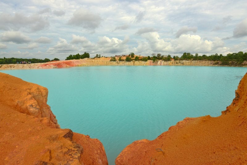 blue lake with brick orange stones