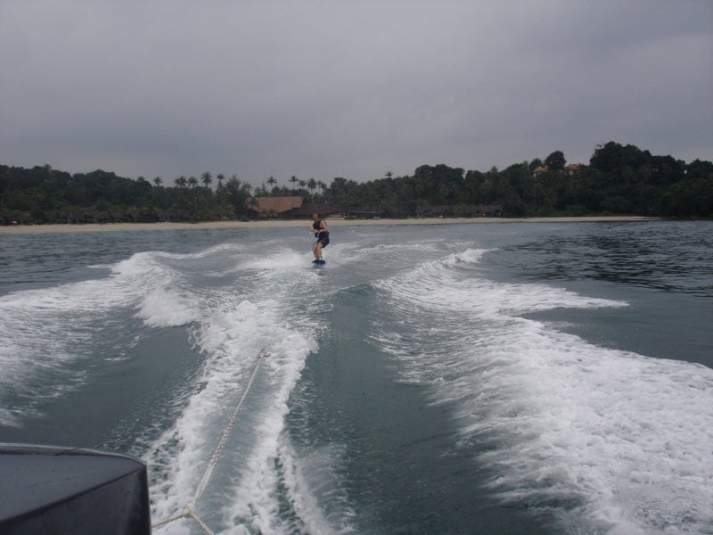 man wake boarding on open waters