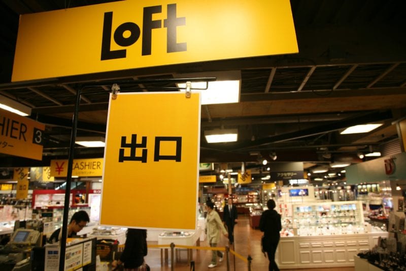 Loft signage in yellow at front of store