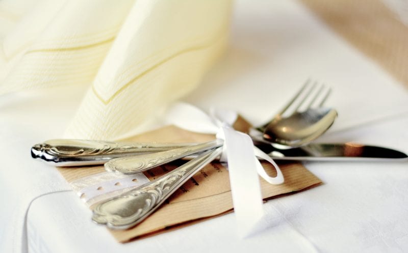 cutlery set tied in white ribbon