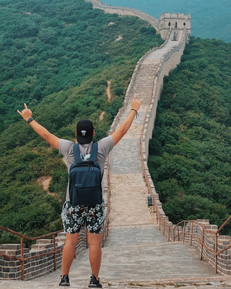 man wearing floral shorts on the Great Wall of China