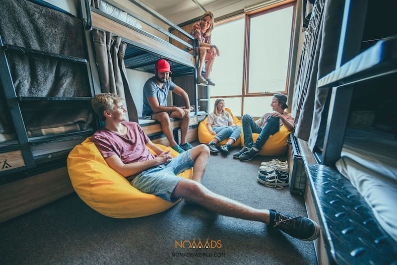 travellers hanging out together in a hostel