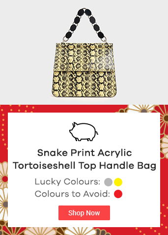 yellow and black snake print handbag with black tortoiseshell top handle bag