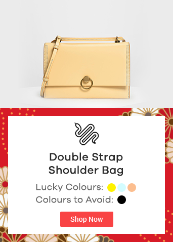 yellow shoulder bag with golden chain strap and lock