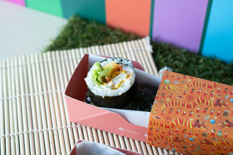 Japanese sushi roll with fried crispy fish and other ingredients
